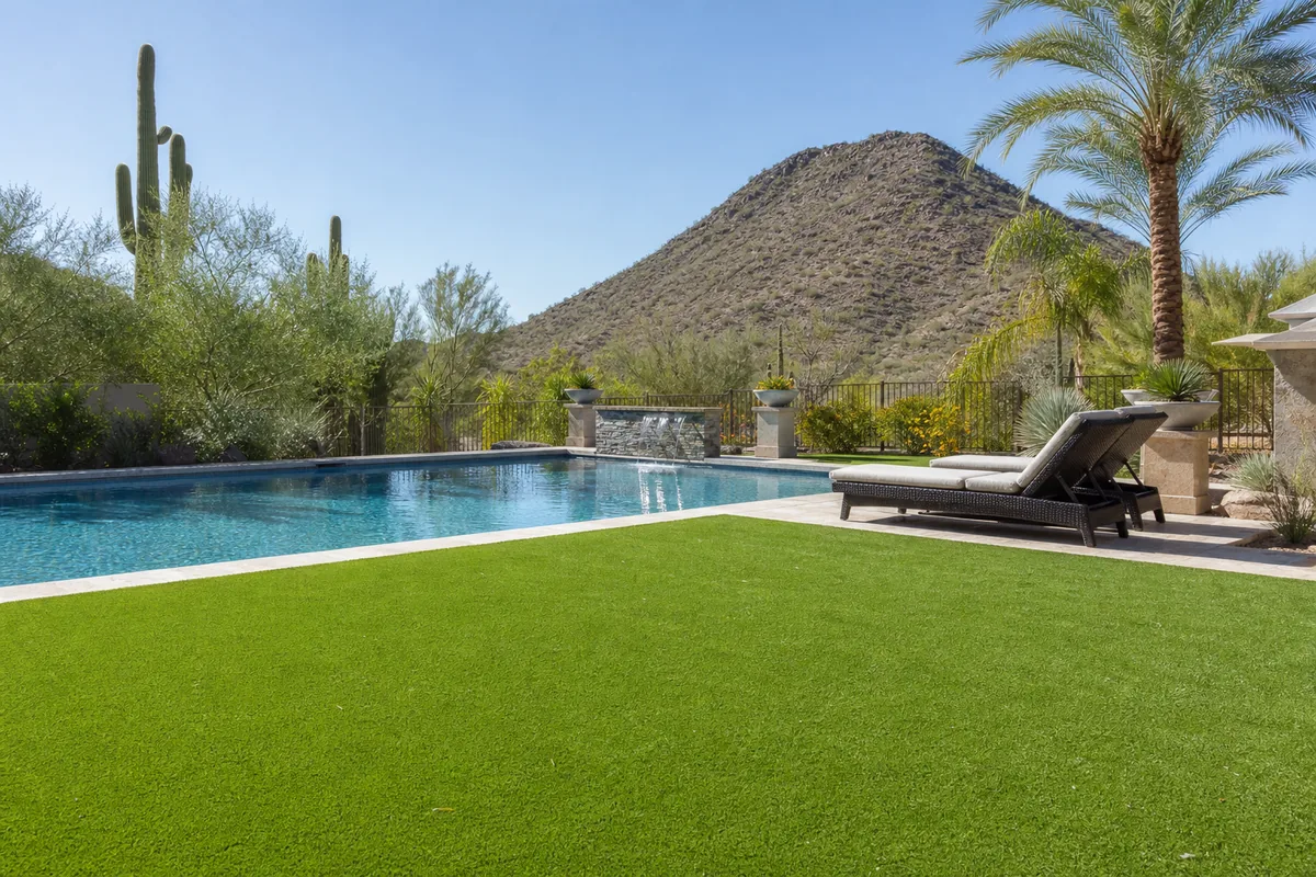 Artificial turf installed around a swimming pool deck at a Scottsdale home